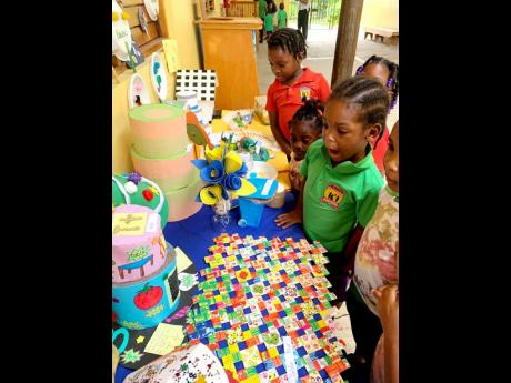 K2 students viewing their items on display at the Eco Champions Day held at Savanna-la-Mar Inclusive Academy (Sav Inclusive) on Tuesday.