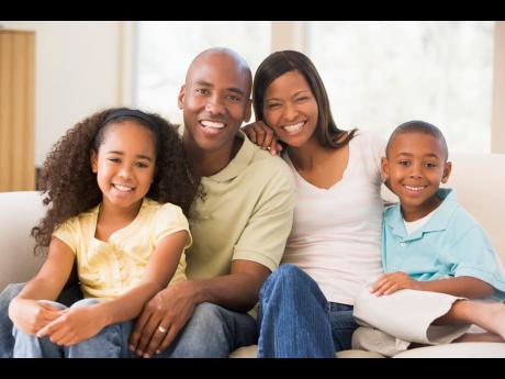 Representational image of a family posing for a photograph.