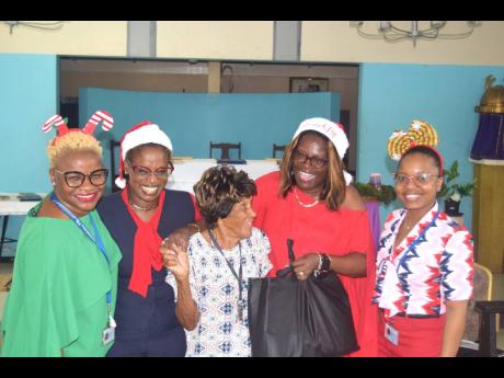 Credit: Contributed The Shipping Association of Jamaica treated 50 elderly residents of Greenwich Farm to grocery care packages last week.