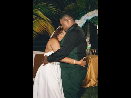 Credit: Contributed Establishing the mood for the evening, the bride and groom share an intimate moment on the dance floor.