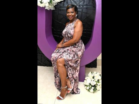 Top: Marcia Osborne, Group HRD and administration manager of Jamaica Co-operative Credit Union League, sits pretty in floral attire.