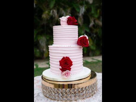 Credit: Contributed Danaia and Jahzeal Clarke’s vanilla and strawberry wedding cake by Iconic Designs.