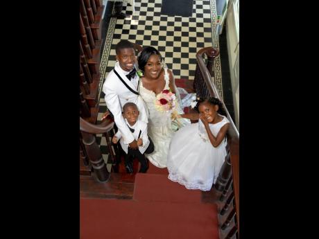 Credit: Contributed Danaia (left) and Jahzeal Clarke, pose with their children Jahzeal Jr and Jahzealina.
