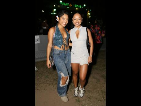 DeeDee Lyew (left) and friend Gina Davis are fashionably on point for the ‘90s party theme.
