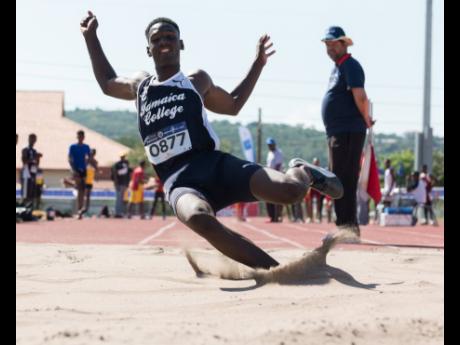 Uroy Ryan of Jamaica College competing in the Class Two boys’ long jump at the Pure Water/JC/R. Danny Williams track meet held at the Ashenheim Stadium on Saturday, January 4, 2020. 