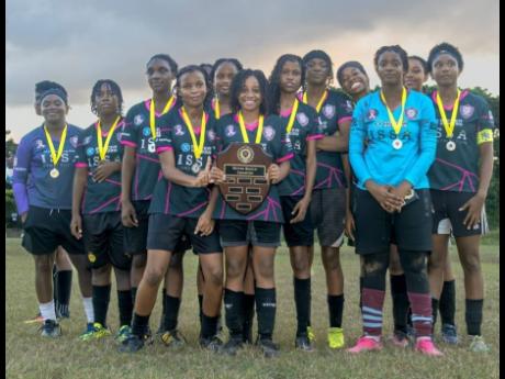 Reinas Academy celebrate with the Reinas Shield after beating Ballaz Academy in the final at the Hughenden Community Centre recently.