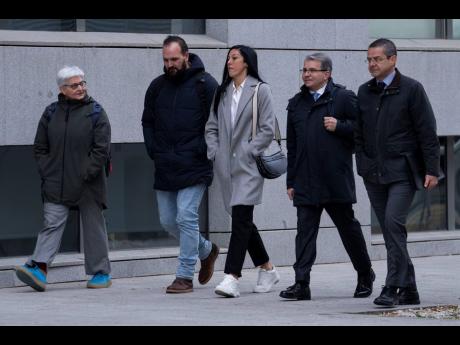 Spanish football player Jenni Hermoso (centre) arrives at the Audiencia Nacional court in Madrid yesterday. 