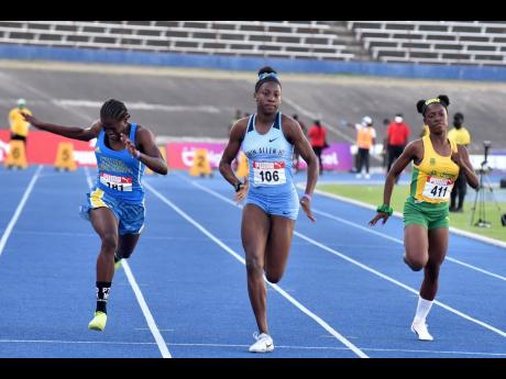 Theianna Terrelonge (centre) of Edwin Allen High  wins the under-17 100 metres at the Carifta Trials on Saturday, March 12, 2022.