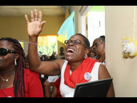 Vanessa Richards (left) tries to hold the tears as Marlen Nichols cries out during the funeral of her friend Brandon Small, one of two security guards killed in a shooting incident at a China Harbour Engineering Company site in December 2022. The funeral w