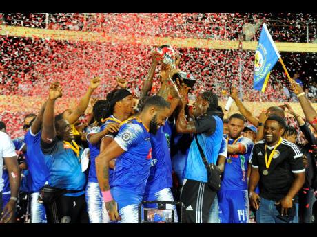 
Mount Pleasant players celebrate their first Jamaica Premier League title at Sabina Park on May 11, 2023.