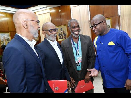 Credit: Rudolph Brown Densil A. Williams (right), principal of The University of the West Indies (UWI), Mona, speaking with Dennis Cohen (left), former deputy CEO, NCB Financial Group; Joseph Taffe (second left), former deputy CEO, Grace Kennedy Financial Group; and Professor M