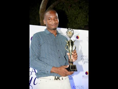 Lueshane Gordon with the Suzette Buchanan Awards for Excellence Team Player of the Year trophy shortly after it was presented to him by year during the Bellevue Hospital Awards Gala at the Hospital in Kingston on Wednesday.