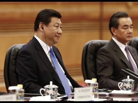 President of China Xi Jinping and Chinese Foreign Minister Wang Yi.