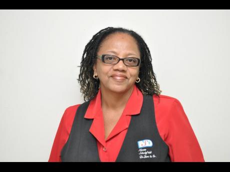 Sandra Risden, paralegal at law firm Nunes, Scholefield, DeLeon & Co, was murdered by gunmen as she travelled along Washington Boulevard in St Andrew on her way to work yesterday morning.