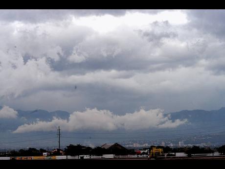 Credit: File In this August 2016 Gleaner photo, storm clouds gather over the parish of St Catherine.