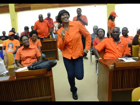 
Then Opposition Leader Portia Simpson Miller shows that she is fit and ready for the local government elections during the People’s National Party’s national candidate councillors meeting at the Jamaica Conference Centre in Kingston on Sunday, Novembe