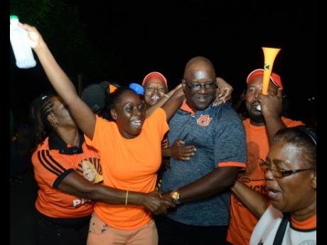 Vanrick Preddie (centre) is being congratulated by supporters after he was declared winner of the Hellshire division at the counting centre at the Ascot High school in the 2016 polls.
