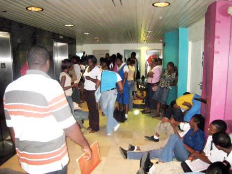 In this file photo, applicants are seen at the Students' Loan Bureau office. 
