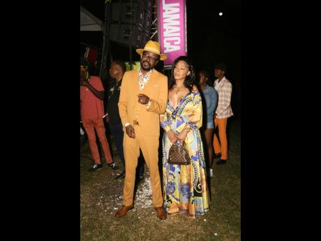 Spotted: Dancehall King Beenie Man (left) and his fiancée, businesswoman Camille Lee, who was glowing in an elegant printed maxi dress.