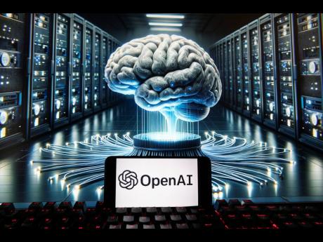 The OpenAI logo is seen displayed on a cell phone with an image on a computer monitor generated by ChatGPT’s Dall-E text-to-image model in Boston. 