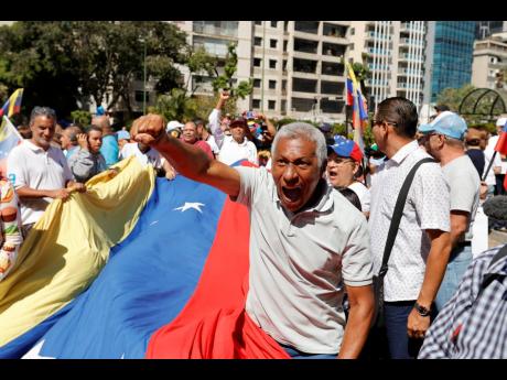 Supporters of opposition coalition presidential hopeful Maria Corina Machado attend her campaign event in Caracas, Venezuela, on Tuesday. 