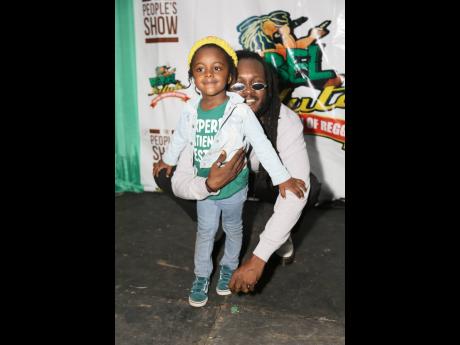 Samory-I (right), poses with his son, Jahseh.