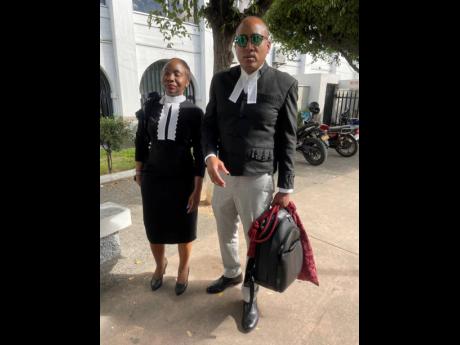 Attorneys-at-law Patrice Riley and Peter Champagnie, KC,  at the Supreme Court in Kingston yesterday. 