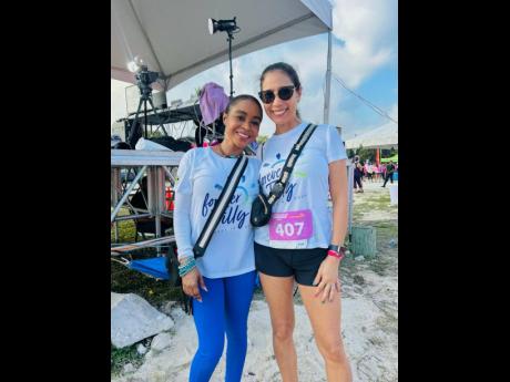 Credit: Contributed Sandals Resorts International’s Kerry Miller (left) and developer Christine ‘Chrissy’ Azan were all smiles, cheering on team ‘Forever Jilly’.