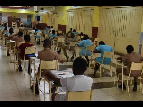 Students writing PEP exams. Gleaner editorial writes: ‘Bright spots apart, PISA report underlines the ongoing crisis in Jamaica’s education, which amounts to a national emergency and should be so declared.’ 