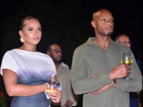 Sub-ten sprint champion Asafa Powell and wife Alyshia listen intently to the presentation on wealth creation at the ‘Doing Wealth Differently’ event.