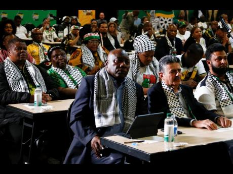 South African President Cyril Ramaphosa, first row left, listens in Johannesburg to the ruling from the top UN court that harshly criticised Israel’s war against Hamas. Israeli Prime Minister Benjamin Netanyahu says Israel will “continue to do what is 