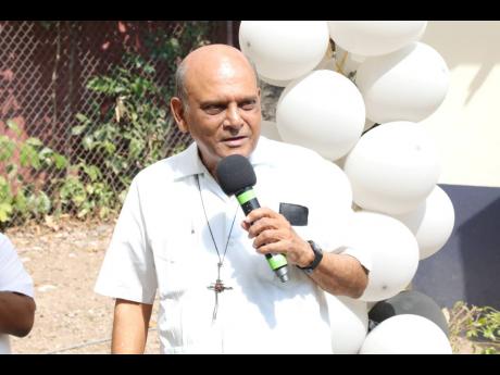 Monsignor Gregory Ramkissoon, founder, Mustard Seed Communities, speaking at the UTech, Jamaica Mustard Seed Communities Centre 25th anniversary blessing ceremony held on January 31, on the grounds of the centre located in Papine.