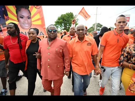 People’s National Party candidates Hubert Williams (third left) for the White Horses division, Sandra Anderson for the Cedar Valley division, and Constantine Bogle (second right) for the Yallahs division, and Junior Green (right) for the Seaforth divisio