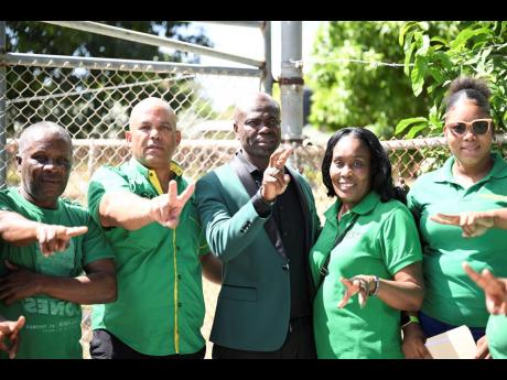 St Thomas Western Member of Parliament James Robertson (second left) with the Jamaica Labour Party’s candidate for the Trinityville division, Dean Jones (third left), and party supporters on nomination day.