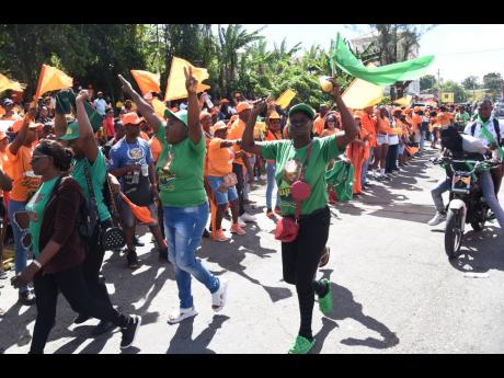 Jamaica Labour Party and People’s National Party supporters in Kellits, Clarendon, on Thursday as they show support for their candidates on nomination day.