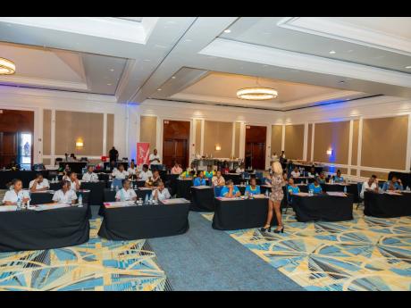 Cortia Bingham McKenzie,founder of We Inspire Girls, engages with the students present on the day of the vision board workshop. 