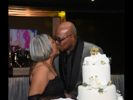 Credit: Ashley Anguin A kiss! Edmund Bartlett, minister of tourism and wife, Carmen, share a beautiful kiss at their 50th wedding anniversary celebration held at the Royalton Negril Resort Spa in Hanover.