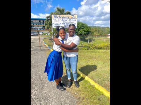  First-place winner in the Ministry of Education and Youth’s TREND Dance Challenge Sabrina Edwards (left) and her mother, Shamette Cope, celebrate the proud achievement at Maud McLeod High School. 