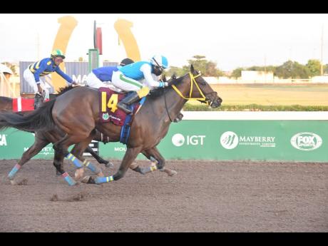 Credit: Anthony Minott/Freelance Photographer GREEN GOLD RUSH (right), ridden by Dane Dawkins, wins the Ash Wednesday Stakes over six and a half furlongs, a three-year-old and upwards overnight-allowance stakes, at Caymanas Park yesterday.