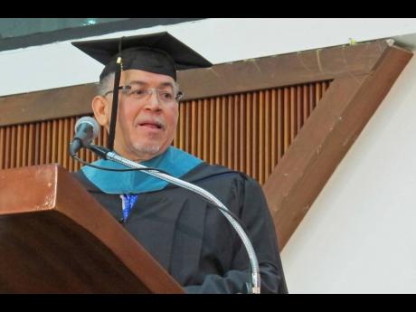 McKeeva Bush, the embattled premier of the Cayman Islands, addresses college graduates in Kingston, Jamaica, December 13, 2012. 