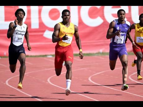 
Wolmer’s Boys’ Schools Gary Card (centre) was one of the few athletes to challenge Kingston College dominance at the Corporate Area Development Meet at the Jamaica College Ashenheim Stadium. Card won the boys’ Class 1 200 metres ahead of Jamaica Col