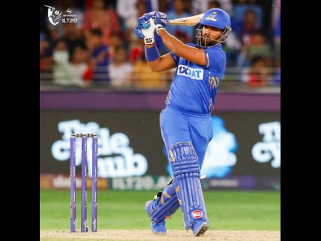 
Mumbai Indian Emirates Nicholas Pooran pulls on his way to 57 during the final of the International League Twenty20 against the Dubai Capitals at the Dubai International Cricket Stadium in the United Arab Emirates yesterday.  