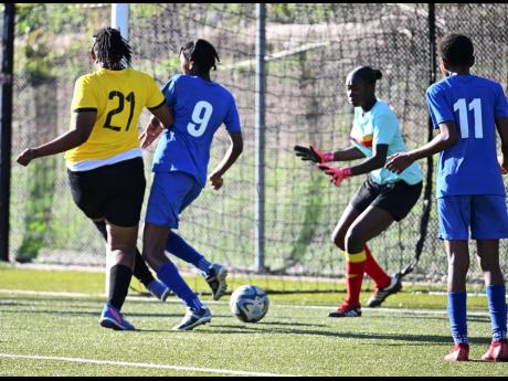 Credit: Ricardo Makyn Cavalier’s Sashanna Watson (left) scores past goalkeeper Jonique McFarlane while under pressure from Proven Girls FC’s Keylee Edwards during last Saturday’s Jamaica Women’s Professional League match at the UWI-JFF Captain Horace Burrell Centre of E