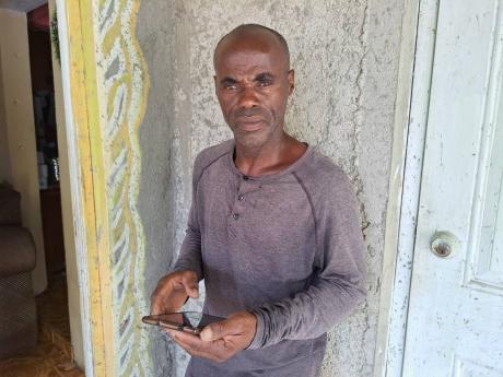Junior Reid, the father of Jason Reid, one of four men who died after the Toyota Mark X in which they were travelling collided with an Audi Q3 motorcar along the intersection of the Daniel Town main road and the North Coast Highway in Trelawny on Sunday.