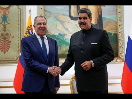 Credit: AP Ariana Cubillos Venezuelan President Nicolas Maduro (right) meets with Russia’s Foreign Minister Sergey Lavrov at Miraflores presidential palace in Caracas, Venezuela, yesterday.