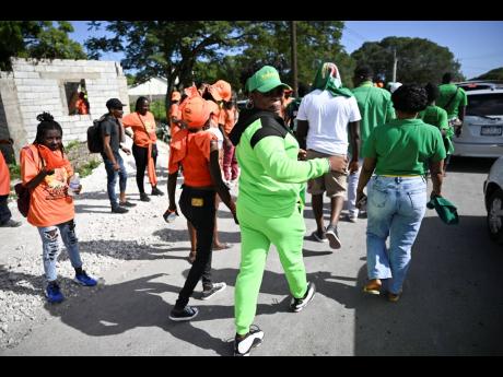 Supporters of the People’s National Party and the Jamaica Labour Party are seen on nomination day at Yallahs Primary School in St Thomas.