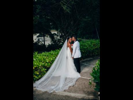 Credit: Joel Photography Romaine gives his bride Jhaneil a sweet smooch as they head towards their ‘happily ever after’.