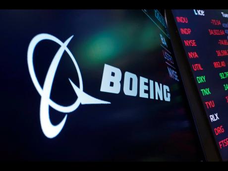 Credit: AP Richard Drew The logo for Boeing appears on a screen on the floor of the New York Stock Exchange.