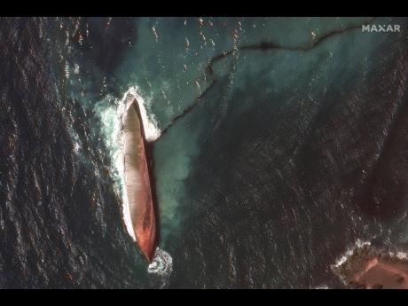 This satellite image provided by Maxar Technologies shows an oil spill caused by an overturned vessel off the coast of Tobago, Trinidad and Tobago, on February 14.