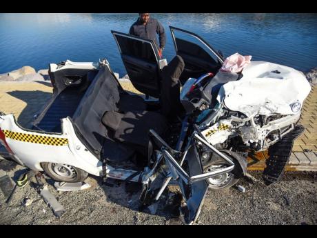 Credit: File An overhead view of the Toyota Succeed that had its roof ripped off in the deadly December 11, 2022 crash.